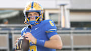 Nov 29, 2025; Pittsburgh, Pennsylvania, USA;  Pittsburgh Panthers quarterback Mason Heintschel (6) warms up before the game against the Miami Hurricanes at Acrisure Stadium. Mandatory Credit: Charles LeClaire-Imagn Images