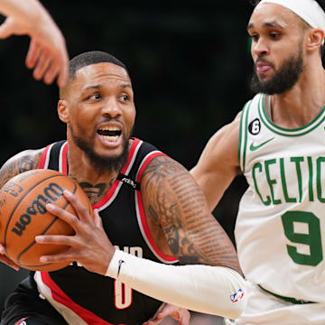 Mar 8, 2023; Boston, Massachusetts, USA; Portland Trail Blazers Damian Lillard (0) drives the ball against Boston Celtics guard Derrick White (9) in the first quarter at TD Garden. Mandatory Credit: David Butler II-Imagn Images