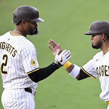 May 14, 2025; San Diego, California, USA; San Diego Padres shortstop Xander Bogaerts (2) is congratulated by Luis Arraez (4) after hitting three-run home run during the first inning against the Los Angeles Angels at Petco Park. Mandatory Credit: Denis Poroy-Imagn Images