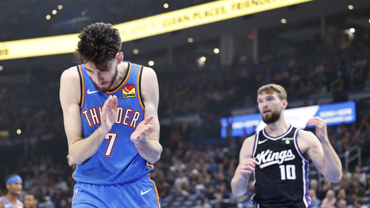 Apr 9, 2024; Oklahoma City, Oklahoma, USA; Oklahoma City Thunder forward Chet Holmgren (7) reacts after a defensive play against Sacramento Kings forward Domantas Sabonis (10) during the first quarter at Paycom Center. Mandatory Credit: Alonzo Adams-USA TODAY Sports