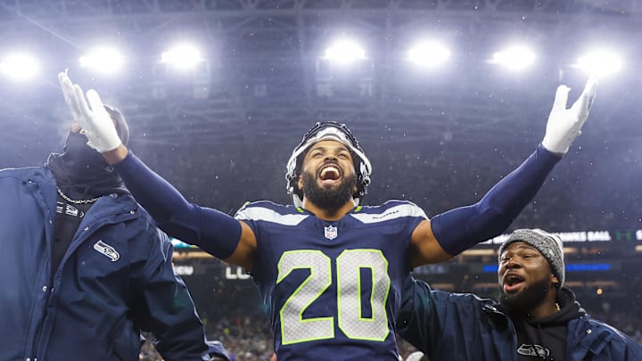 Dec 18, 2023; Seattle, Washington, USA; Seattle Seahawks safety Julian Love (20) celebrates on the bench after his second interception of the fourth quarter against the Philadelphia Eagles at Lumen Field. Mandatory Credit: Joe Nicholson-Imagn Images