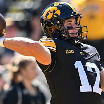 Sep 7, 2024; Iowa City, Iowa, USA; Iowa Hawkeyes quarterback Cade McNamara (12) warms up before the game against the Iowa State Cyclones at Kinnick Stadium.