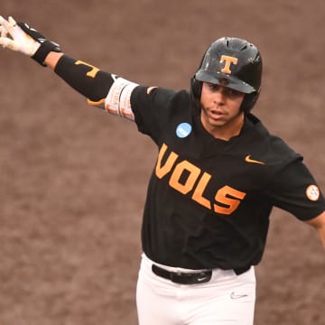 June 9: Tennessee Volunteers designated hitter Dalton Bargo rounds the bases after hitting one of his two home runs against Evansville in Game 3 of their super regionals. Tennessee won 12-1 to advance to the College World Series.