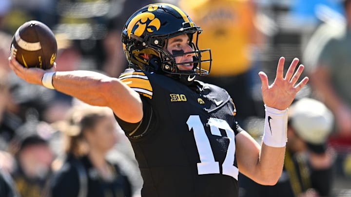 Sep 7, 2024; Iowa City, Iowa, USA; Iowa Hawkeyes quarterback Cade McNamara (12) warms up before the game against the Iowa State Cyclones at Kinnick Stadium.