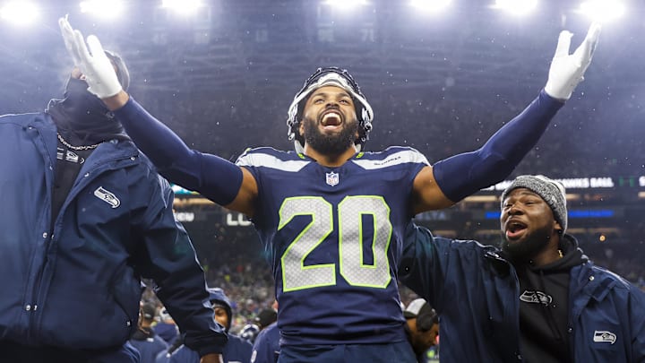 Dec 18, 2023; Seattle, Washington, USA; Seattle Seahawks safety Julian Love (20) celebrates on the bench after his second interception of the fourth quarter against the Philadelphia Eagles at Lumen Field. Mandatory Credit: Joe Nicholson-Imagn Images