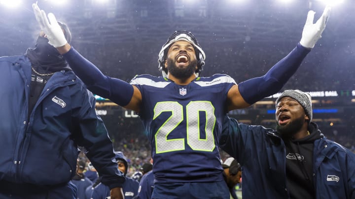 Dec 18, 2023; Seattle, Washington, USA; Seattle Seahawks safety Julian Love (20) celebrates on the bench after his second interception of the fourth quarter against the Philadelphia Eagles at Lumen Field. Mandatory Credit: Joe Nicholson-USA TODAY Sports