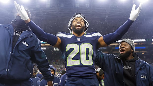 Seattle Seahawks safety Julian Love celebrates on the bench after his second interception against the Philadelphia Eagles.
