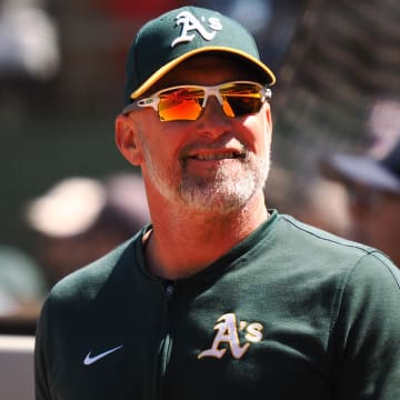 May 25, 2024; Oakland, California, USA; Oakland Athletics manager Mark Kotsay (7) smiles after the game against the Houston Astros at Oakland-Alameda County Coliseum. Mandatory Credit: Kelley L Cox-USA TODAY Sports