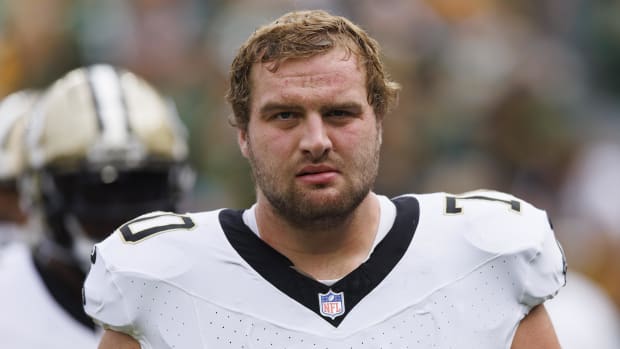 ew Orleans Saints offensive tackle Trevor Penning (70) during warmups.