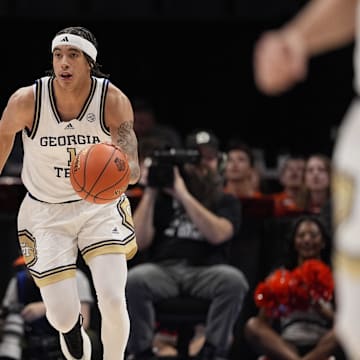 Mar 12, 2025; Charlotte, NC, USA; Georgia Tech Yellow Jackets guard Naithan George (1) brings the ball up court against the Virginia Cavaliers during the second half at Spectrum Center. Mandatory Credit: Jim Dedmon-Imagn Images