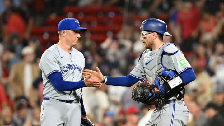 Toronto Blue Jays relief pitcher Chad Green (57) high-fives catcher Danny Jansen (9) after a game against the Boston Red Sox during the ninth inning at Fenway Park on June 25.