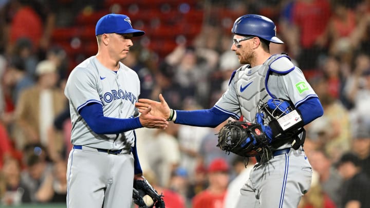 Jun 25, 2024; Boston, Massachusetts, USA; Toronto Blue Jays relief pitcher Chad Green (57) high-fives catcher Danny Jansen (9) after a game against the Boston Red Sox during the ninth inning at Fenway Park. Mandatory Credit: Brian Fluharty-USA TODAY Sports