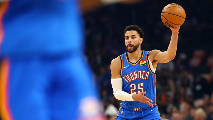Apr 27, 2026; Phoenix, Arizona, USA; Oklahoma City Thunder guard Ajay Mitchell (25) against the Phoenix Suns during game four of the first round of the 2026 NBA Playoffs at Mortgage Matchup Center. Mandatory Credit: Mark J. Rebilas-Imagn Images