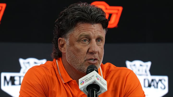 Jul 9, 2025; Frisco, TX, USA; Oklahoma State head coach Mike Gundy speaks with the media during 2025 Big 12 Football Media Days at The Star. Mandatory Credit: Raymond Carlin III-Imagn Images Jul 9, 2025; Frisco, TX, USA; Oklahoma State head coach Mike Gundy speaks with the media during 2025 Big 12 Football Media Days at The Star. Mandatory Credit: Raymond Carlin III-Imagn Images