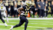 Nov 10, 2024; New Orleans, Louisiana, USA;   New Orleans Saints running back Alvin Kamara (41) rushes against the Atlanta Falcons during the first half at Caesars Superdome. Mandatory Credit: Stephen Lew-Imagn Images