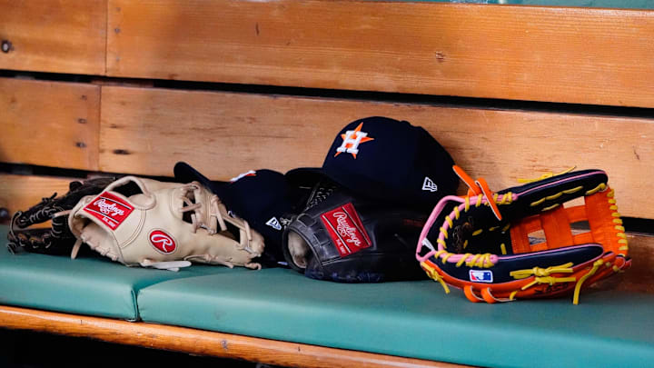May 16, 2022; Boston, Massachusetts, USA; A general view of gloves and Houston Astros hats prior to the game against the Boston Red Sox at Fenway Park. May 16, 2022; Boston, Massachusetts, USA; A general view of gloves and Houston Astros hats prior to the game against the Boston Red Sox at Fenway Park.