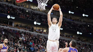 Feb 22, 2025; Chicago, Illinois, USA; Chicago Bulls forward Zach Collins (12) goes up for a dunk
