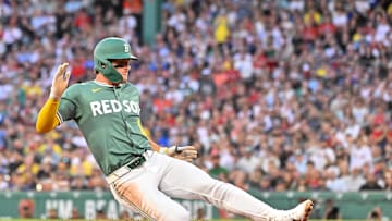 Aug 1, 2025; Boston, Massachusetts, USA; Boston Red Sox left fielder Roman Anthony (19) slides into third base during the third inning against the Houston Astros at Fenway Park. Mandatory Credit: Eric Canha-Imagn Images