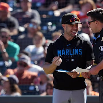 Miami Marlins manager Skip Schumaker (left) talks with home plate umpire Jacob Metz (94) during the ninth inning against the San Francisco Giants at Oracle Park on Sept 1.