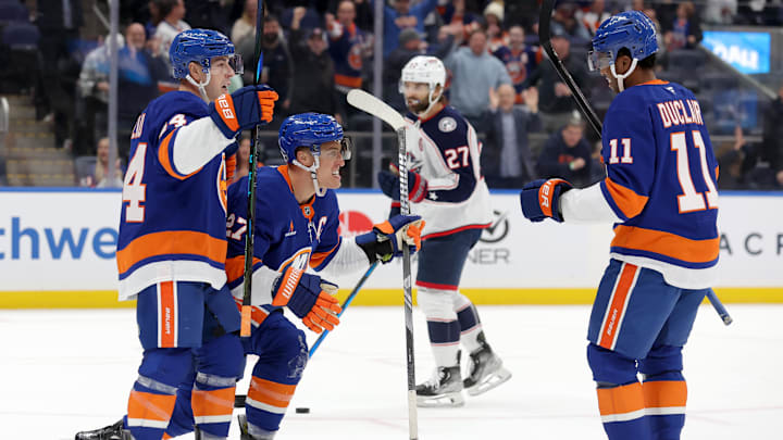 Mar 24, 2025; Elmont, New York, USA; New York Islanders left wing Anders Lee (27) celebrates his goal against the Columbus Blue Jackets with center Jean-Gabriel Pageau (44) and left wing Anthony Duclair (11) during the second period at UBS Arena. Mandatory Credit: Brad Penner-Imagn Images