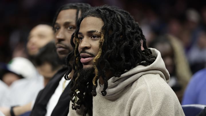Mar 21, 2026; Charlotte, North Carolina, USA; Memphis Grizzlies guard Ja Morant watches from the bench during the second half against the Charlotte Hornets at Spectrum Center. Mandatory Credit: Brian Westerholt-Imagn Images