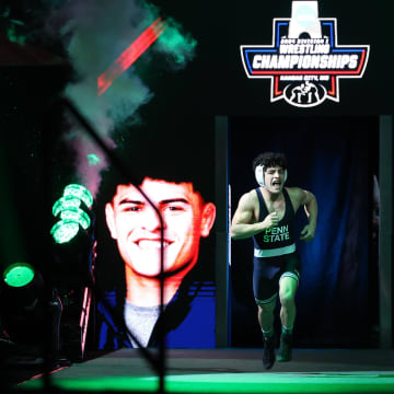 Penn State wrestler Beau Bartlett enters the arena for the 141-pound championship bout at the 2024 NCAA Wrestling Championships. 