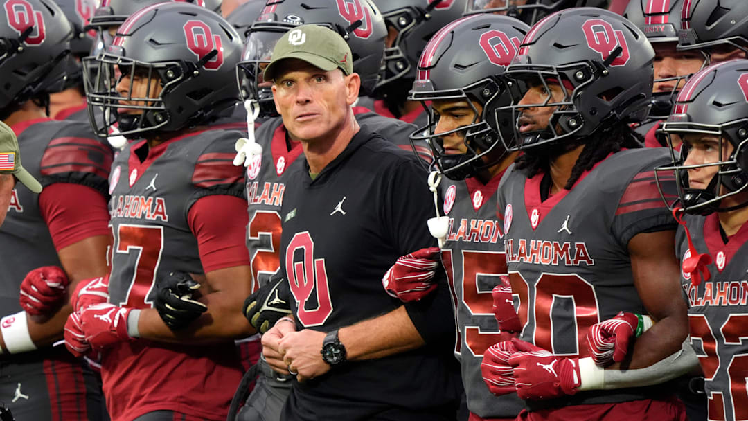 Oklahoma coach Brent Venables locks arms with players before a college football game between the University of Oklahoma Sooners (OU) and the Maine Black Bears at Gaylord Family - Oklahoma Memorial Stadium in Norman, Okla., Saturday, Nov. 2, 2024.