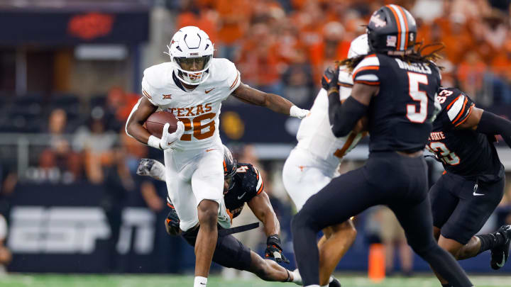 Dec 2, 2023; Arlington, TX, USA; Texas Longhorns running back Quintrevion Wisner (26) runs the ball against the Oklahoma State Cowboys during the fourth quarter at AT&T Stadium. Mandatory Credit: Andrew Dieb-USA TODAY Sports