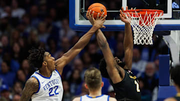 Feb 19, 2025; Lexington, Kentucky, USA; Kentucky Wildcats center Amari Williams (22) blocks a shot by Vanderbilt Commodores forward Jaylen Carey (22) during the second half at Rupp Arena at Central Bank Center. Mandatory Credit: Jordan Prather-Imagn Images