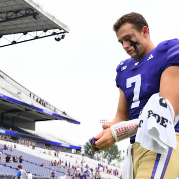 Huskies quarterback Will Rogers (7) walks off the field after beating Michigan State.