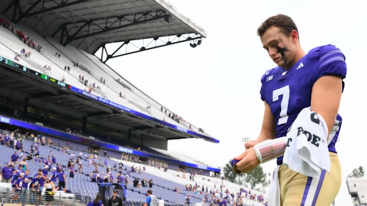 Huskies quarterback Will Rogers (7) walks off the field after beating Michigan State.