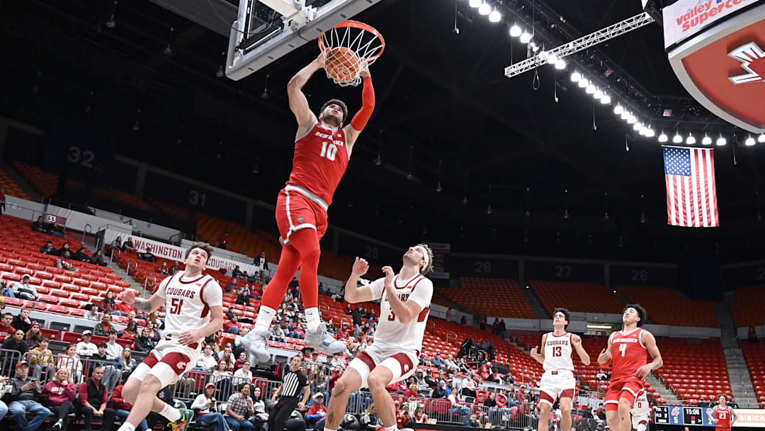 Oct 25, 2025; Pullman, WA, USA; New Mexico Lobos forward Tomislav Buljan (10) dunks the ball against Washington State Cougars forward Simon Hildebrandt (3) in the first half at Friel Court at Beasley Coliseum. Mandatory Credit: James Snook-Imagn Images Oct 25, 2025; Pullman, WA, USA; New Mexico Lobos forward Tomislav Buljan (10) dunks the ball against Washington State Cougars forward Simon Hildebrandt (3) in the first half at Friel Court at Beasley Coliseum. Mandatory Credit: James Snook-Imagn Images