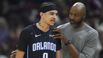 Orlando Magic head coach Jamahl Mosley talks with guard Anthony Black (0) in the second quarter against the Cleveland Cavaliers at Rocket Mortgage FieldHouse. 