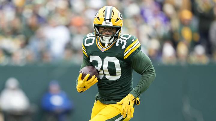 Nov 23, 2025; Green Bay, Wisconsin, USA; Green Bay Packers running back Chris Brooks (30) runs after the catch against the Minnesota Vikings during the first half at Lambeau Field. Mandatory Credit: Kayla Wolf-Imagn Images