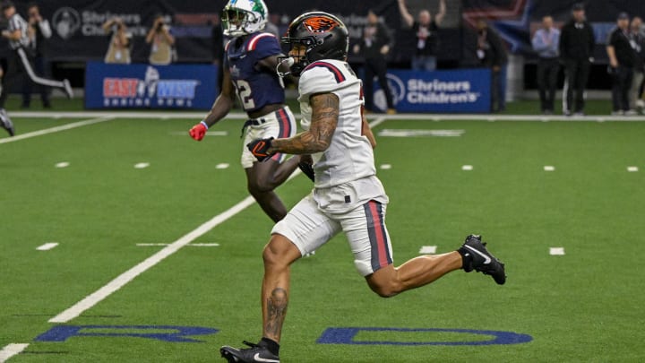 Feb 1, 2024; Frisco, TX, USA; East wide receiver Anthony Gould of Oregon State (2) returns a punt for a touchdown against the West during the second half at the Ford Center at The Star. Mandatory Credit: Jerome Miron-USA TODAY Sports