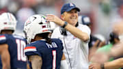 Nov 22, 2025; Tucson, Arizona, USA; Arizona Wildcats head coach Brent Brennan celebrates with quarterback Noah Fifita (1) against the Baylor Bears at Casino Del Sol Stadium. Mandatory Credit: Mark J. Rebilas-Imagn Images