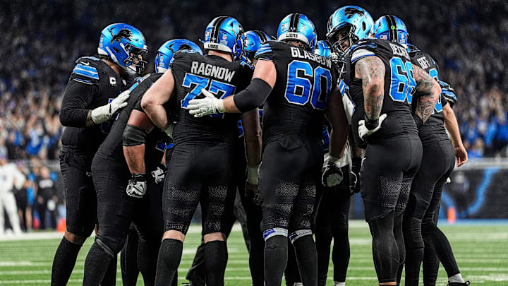 Detroit Lions offensive line huddle before a play against Minnesota Vikings during the second half at Ford Field in Detroit on Sunday, Jan. 5, 2025.
