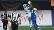 Nov 17, 2024; Vancouver, British Columbia, CAN;  Toronto Argonauts wide receiver Dejon Brissett (18) catches the ball against Winnipeg Blue Bombers defensive back Deatrick Nichols (1) during the second quarter at BC Place. Mandatory Credit: Anne-Marie Sorvin-Imagn Images