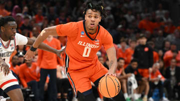 Mar 30, 2024; Boston, MA, USA; Illinois Fighting Illini guard Terrence Shannon Jr. (0) dribbles the ball against Connecticut Huskies guard Hassan Diarra (10) in the finals of the East Regional of the 2024 NCAA Tournament at TD Garden. Mandatory Credit: Brian Fluharty-USA TODAY Sports