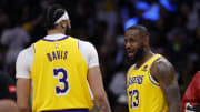 Apr 3, 2024; Washington, District of Columbia, USA; Los Angeles Lakers forward LeBron James (23) talks with Lakers forward Anthony Davis (3) during a timeout against the Washington Wizards in the second half at Capital One Arena. Mandatory Credit: Geoff Burke-USA TODAY Sports