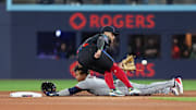 May 2, 2025; Toronto, Ontario, CAN; Cleveland Guardians third baseman José Ramírez (11) is safe at second base ahead of the tag from Toronto Blue Jays shortstop Bo Bichette (11) at Rogers Centre. Mandatory Credit: Nick Turchiaro-Imagn Images