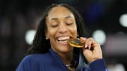 Aug 11, 2024: United States forward A'ja Wilson celebrates with the gold medal after defeating France.