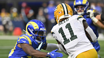 Oct 6, 2024; Inglewood, California, USA; Los Angeles Rams cornerback Josh Wallace (30) tackles Green Bay Packers wide receiver Jayden Reed (11) on a second qiuaarter pass pay at SoFi Stadium. Mandatory Credit: Robert Hanashiro-Imagn Images