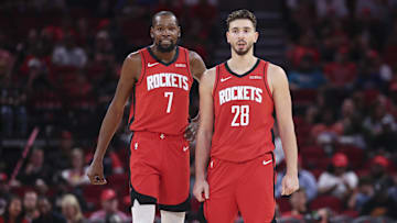 Oct 24, 2025; Houston, Texas, USA; Houston Rockets forward Kevin Durant (7) and center Alperen Sengun (28) stand on the court during the first quarter against the Detroit Pistons at Toyota Center. Mandatory Credit: Troy Taormina-Imagn Images