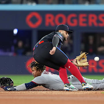 May 2, 2025; Toronto, Ontario, CAN; Cleveland Guardians third baseman José Ramírez (11) is safe at second base ahead of the tag from Toronto Blue Jays shortstop Bo Bichette (11) at Rogers Centre. Mandatory Credit: Nick Turchiaro-Imagn Images