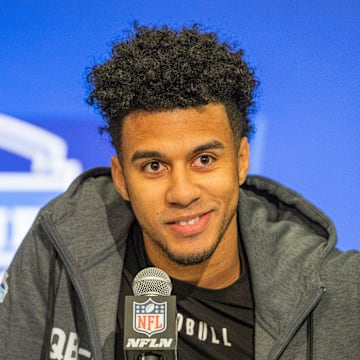 Jordan Travis talks to reporters during 2024's NFL combine.