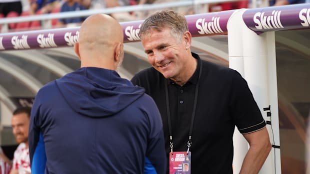 Chelsea head coach Enzo Maresca (left) visits with Wrexham head coach Phil Parkinson before kickoff at Levi's Stadium.