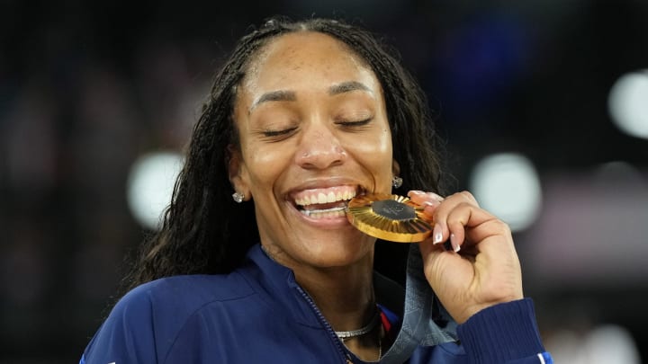 Aug 11, 2024: United States forward A'ja Wilson celebrates with the gold medal after defeating France.