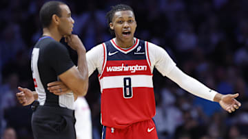 Apr 13, 2025; Miami, Florida, USA; Washington Wizards guard Bub Carrington (8) argues with an official against the Miami Heat during the second half at Kaseya Center. Mandatory Credit: Rhona Wise-Imagn Images