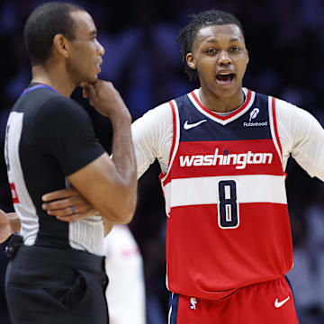 Apr 13, 2025; Miami, Florida, USA; Washington Wizards guard Bub Carrington (8) argues with an official against the Miami Heat during the second half at Kaseya Center. Mandatory Credit: Rhona Wise-Imagn Images